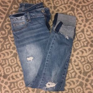 Destressed skinny cuffed jeans